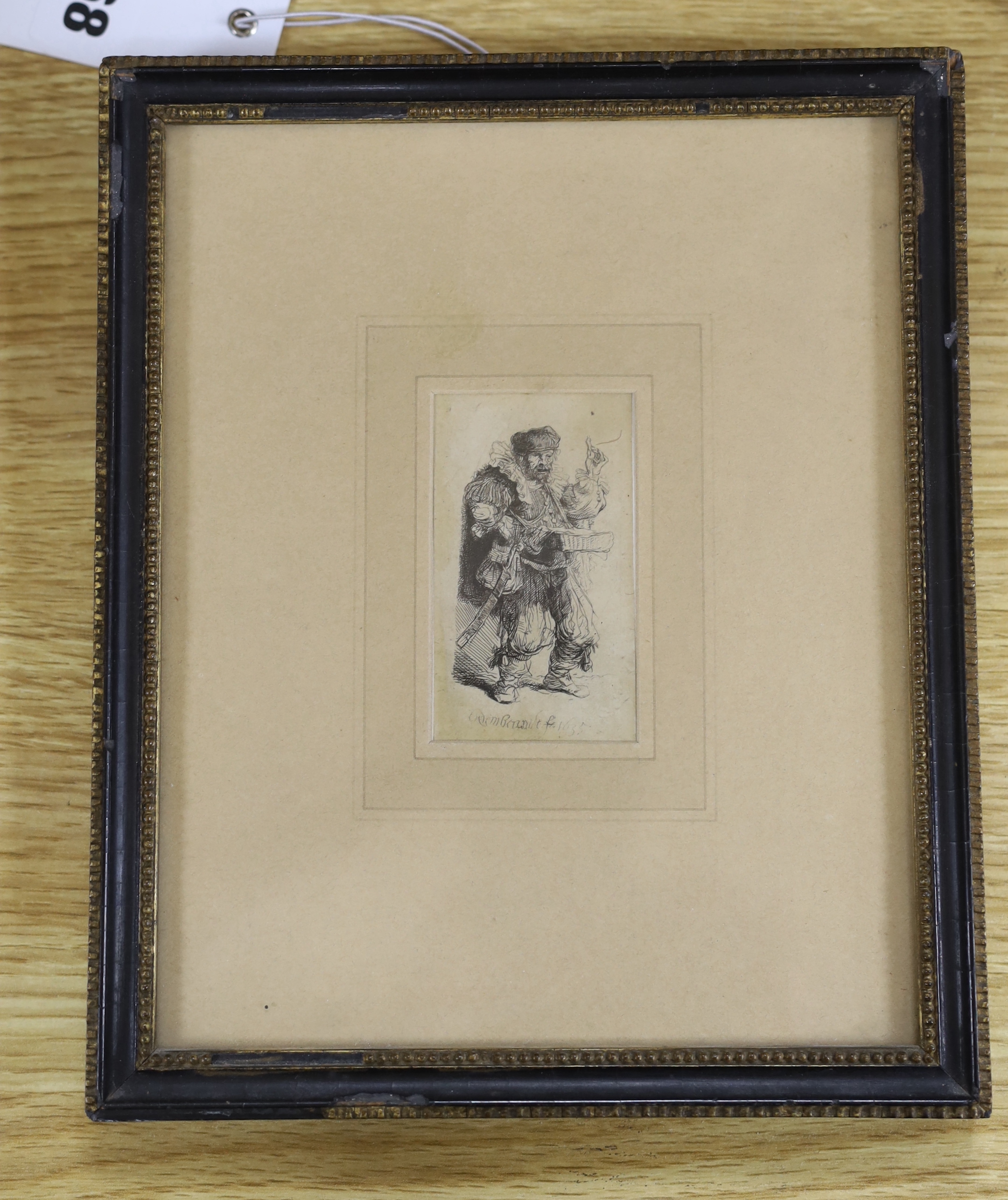 After Rembrandt van Rijn (1606-1669), a small engraving, Le charlatan, signed and dated 1635 in the plate, visible sheet 7.25 x 4cm